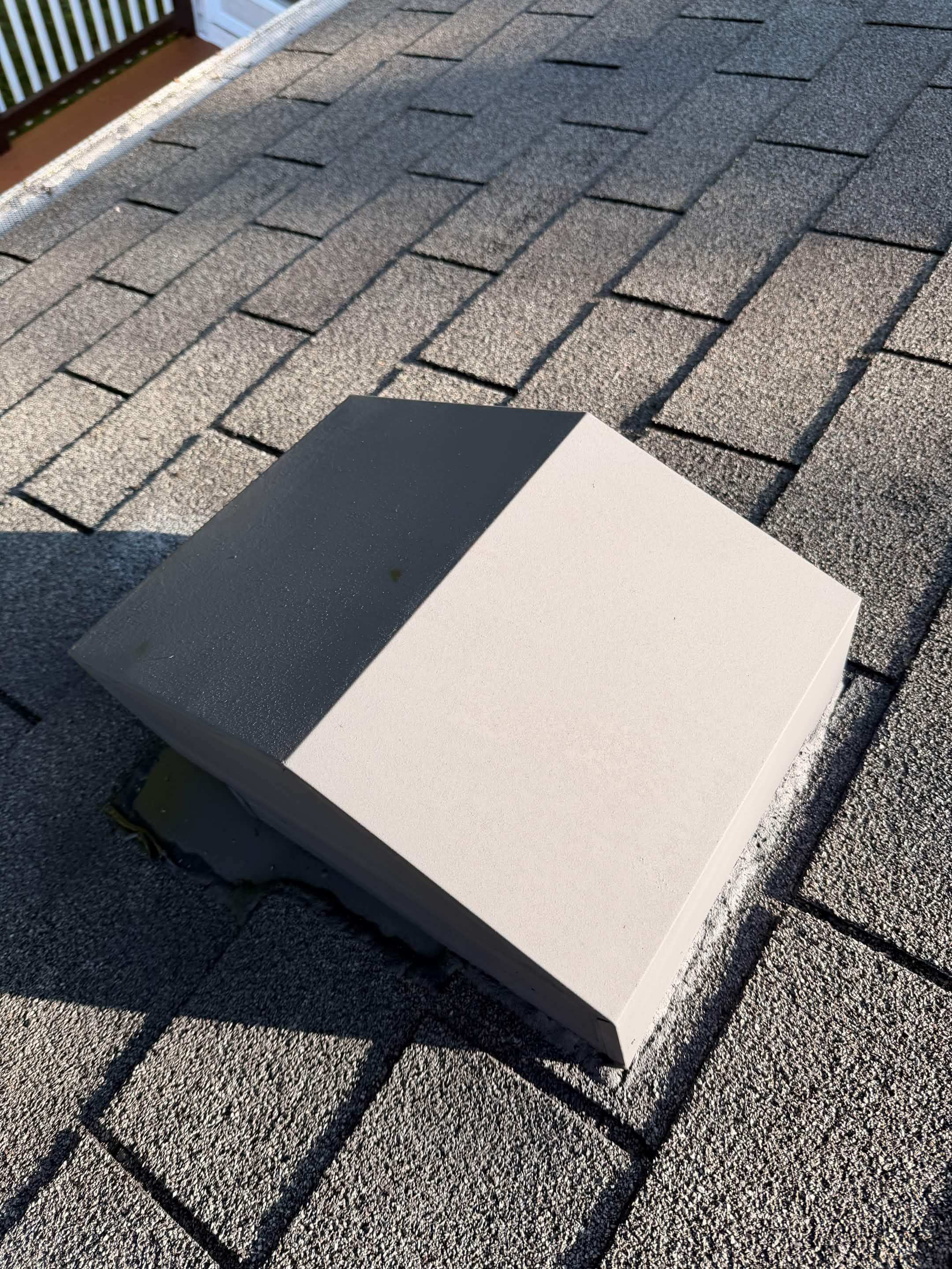 Protected asphalt shingle sample after treatment